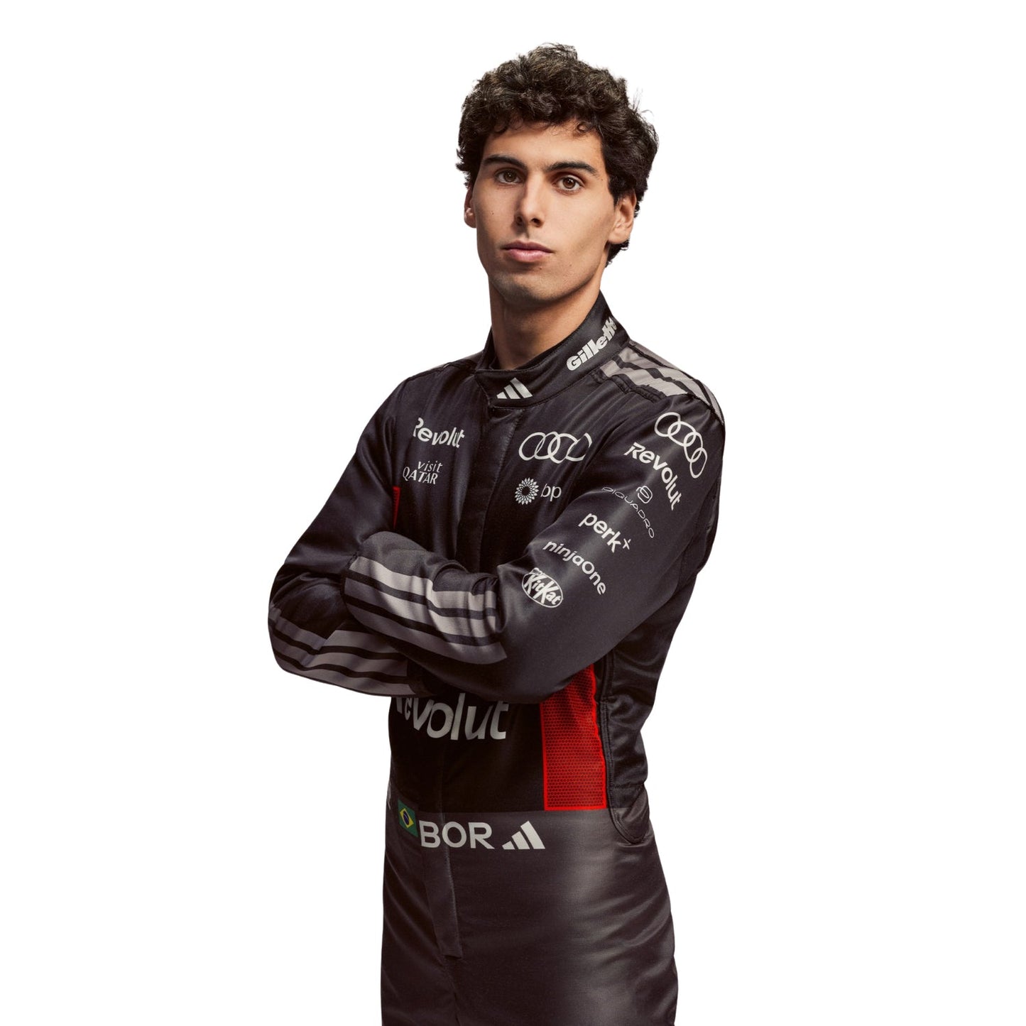 Gabriel Bortoleto wearing a black 2026 Audi F1 racing suit with various sponsor logos - Kartx Gear