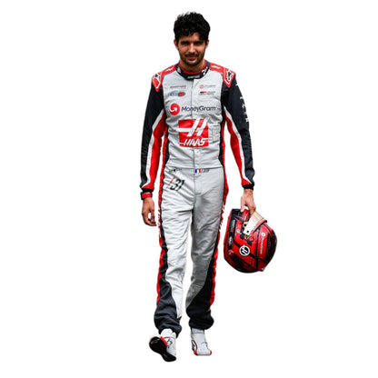 Esteban Ocon wearing a 2025 Haas F1 200th Race Look Canadian GP racing suit with a helmet - Kartx Gear