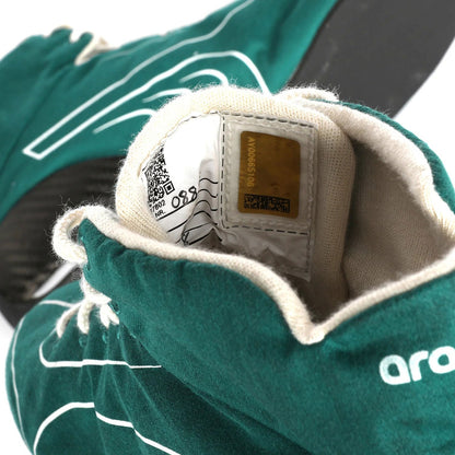Close-up of a green Lance Stroll 2025 Aston Martin F1 Racing Shoes with a brand label - Kartx Gear