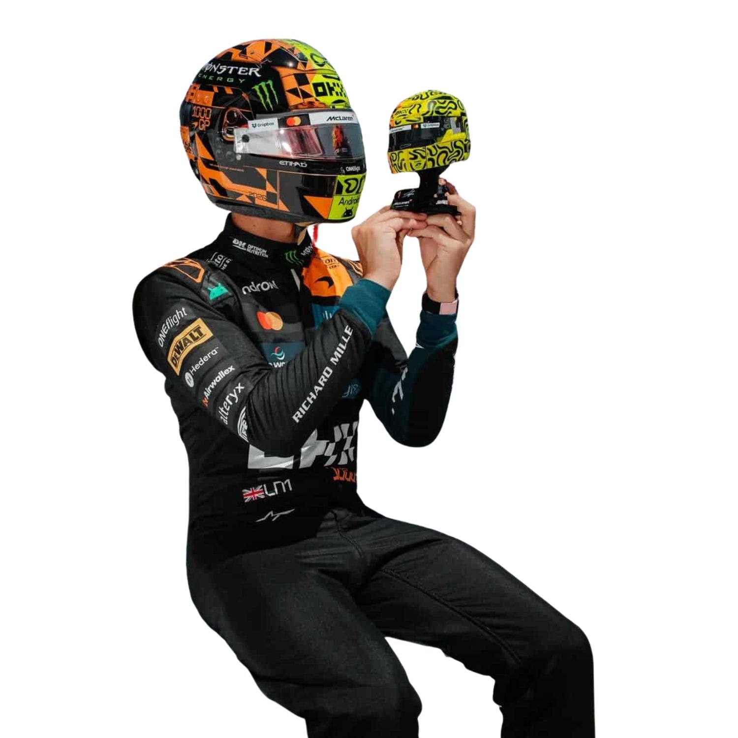 Close Up View of Lando Norris wearing a 2026 McLaren 1000 GP F1 racing suit and helmet in Monaco holding a Lego Helmet - Kartx Gear