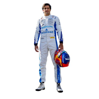 Carlos Sainz wearing a 2026 Williams F1 white racing suit with blue accents and a colorful helmet - Kartx Gear