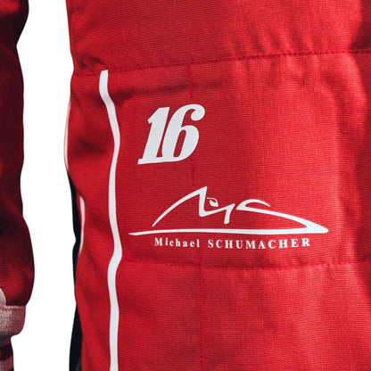 Close-up of a red racing suit or jacket fabric with a white vertical stripe, the number 16, and a white Michael Schumacher signature graphic.