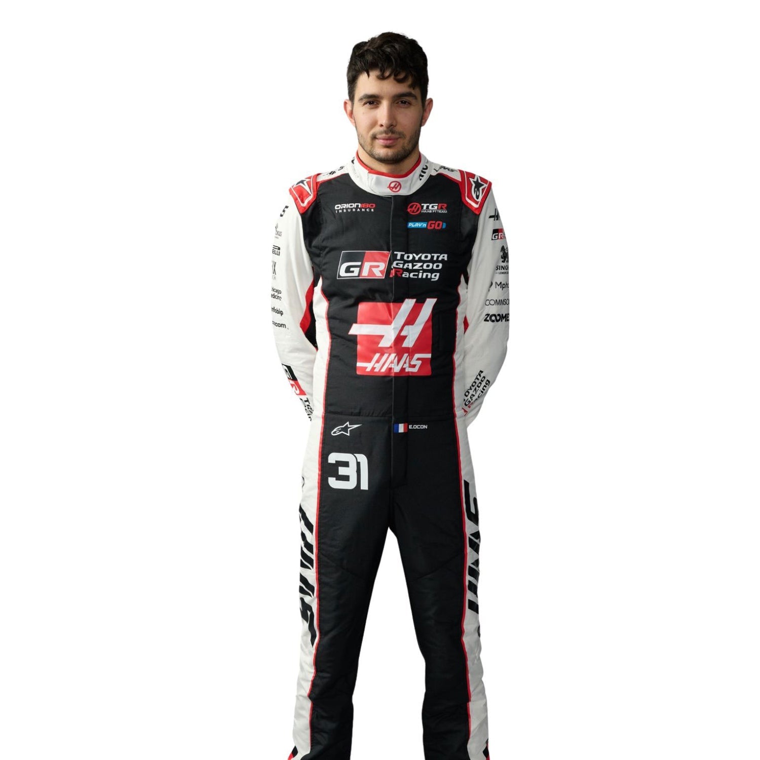 Esteban Ocon wearing a 2026 F1 Haas racing suit with various sponsor logos - Kartx Gear