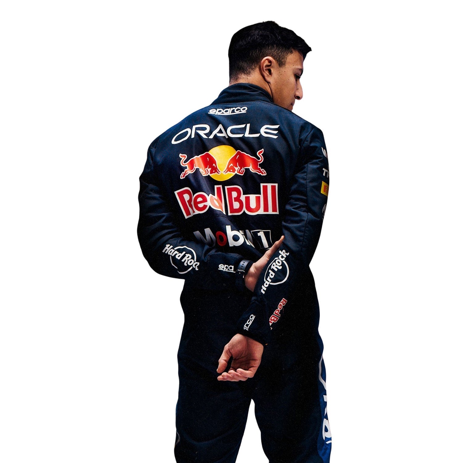Isack Hadjar wearing a dark blue 2026 Red Bull F1 racing suit with Red Bull and Oracle logos - Kartx Gear