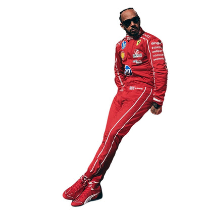 A full-body cutout of Formula 1 driver Lewis Hamilton wearing a red Scuderia Ferrari racing suit with sponsor logos, matching red Ferrari shoes, and sunglasses, set against a solid white background.