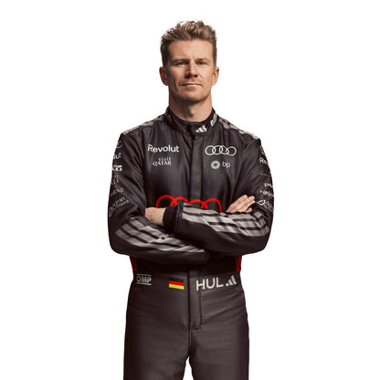 Nico Hulkenberg wearing a black Audi 2026 F1 racing suit with various sponsor logos on a white background - Kartx Gear